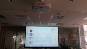Epson EB-G6270W projecting onto130" screen in library 