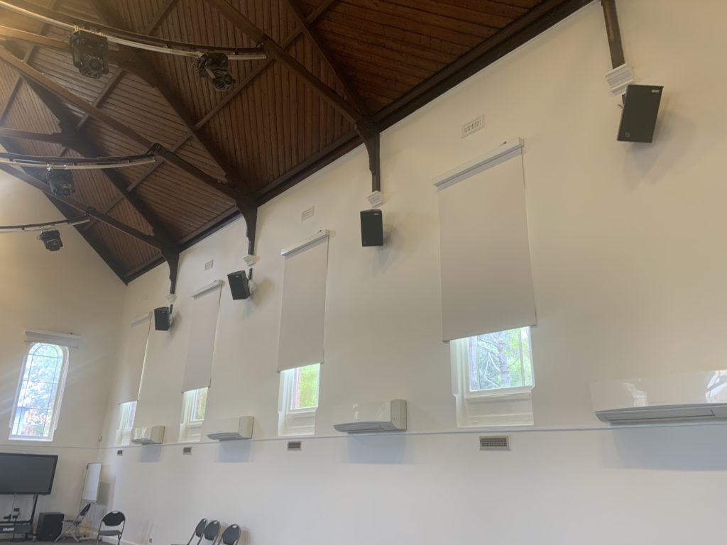 Speaker placement to optimise performance and protect aesthetics