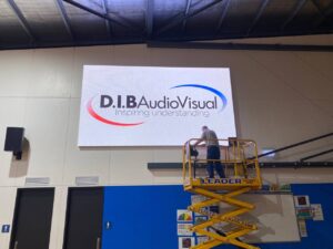 DIB Service technician repairing a screen